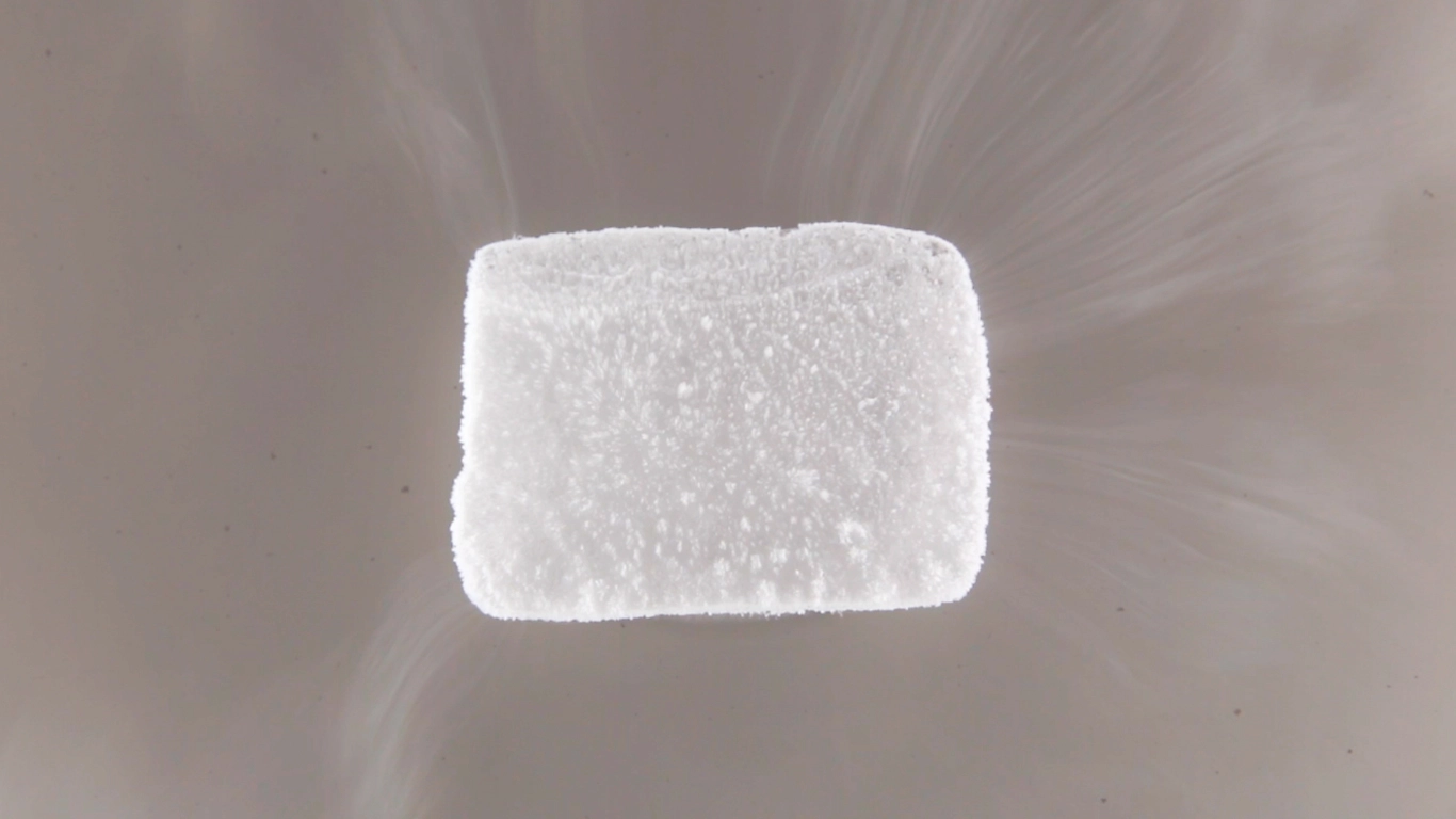 Dry ice properly stored in an insulated cooler for food preservation during travel